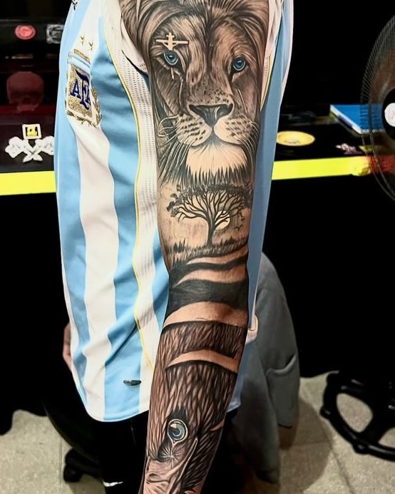 Manga con león, árbol y ojo